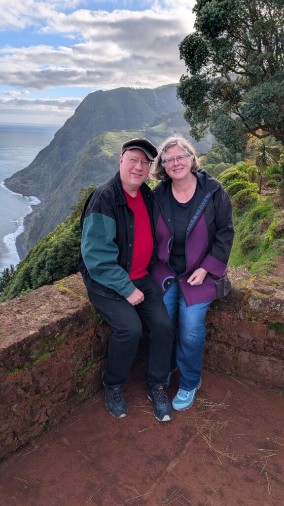 The author and their spouse posing in the botanical gardens.