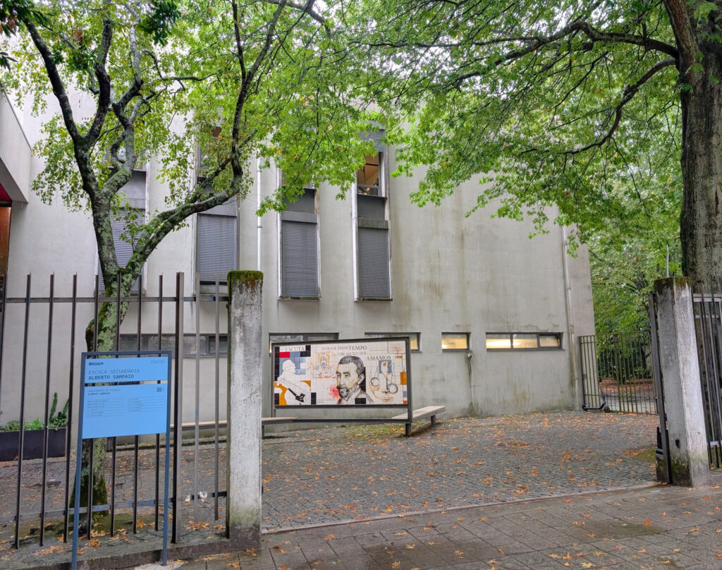 High school exterior with colorful announcements board.